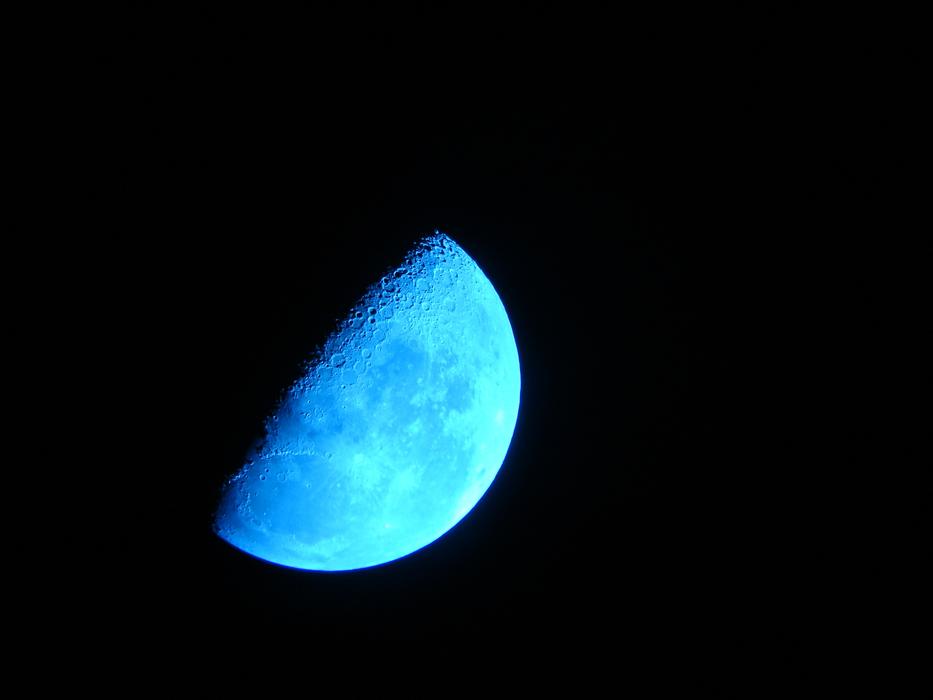 A blue moon in a black sky