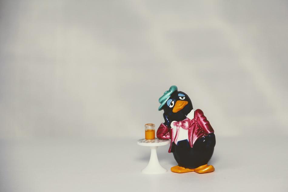 penguin at the bar with a glass