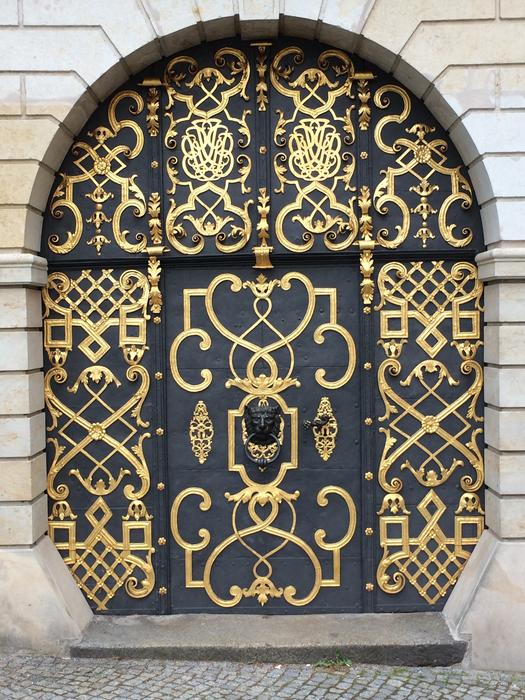 gold pattern on the black door