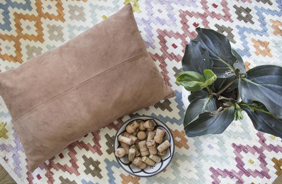 brown pillow with leaves
