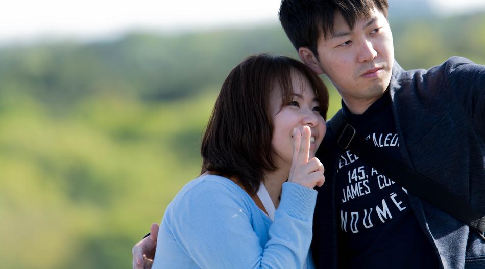 a happy couple on a green background