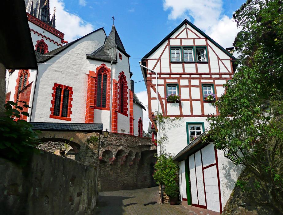 An old white building with red patterns