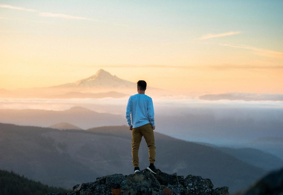 the white shirt with the man on the mountain.