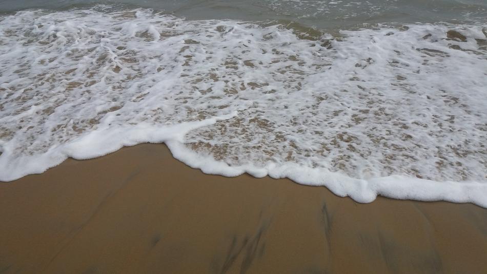 white waters in a sandy beach