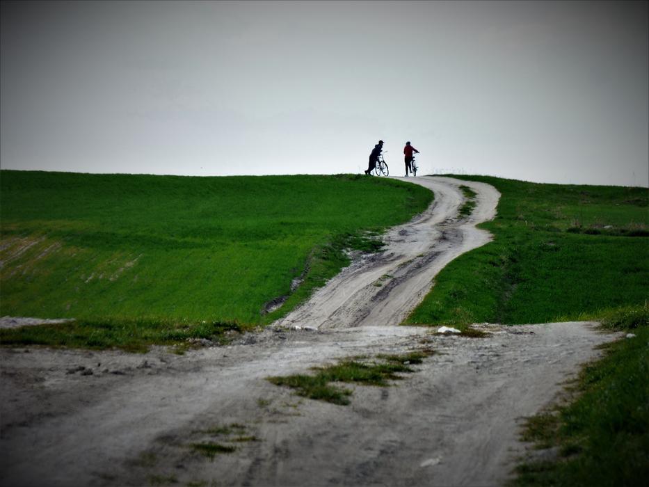 people in the distance on the road