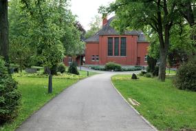 red old house with a road