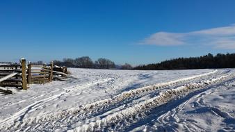 snow glade with a fence