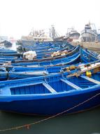 blue boats on land