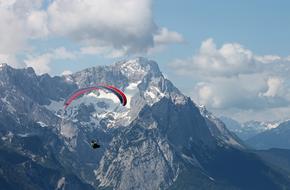 man parachuting in the sky