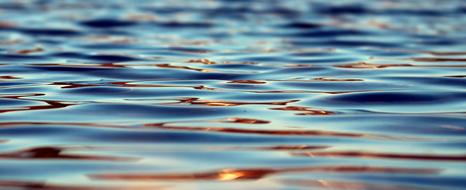 blue water with golden Waves