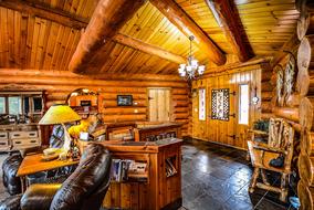 interior of living room in log house, render
