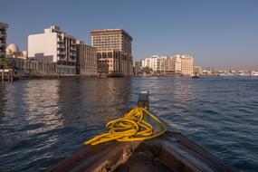 landscape of wooden boat sailing along the coast of Dubai