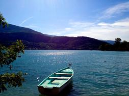 blue wooden boat in the lake