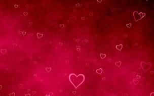 hearts at grunge textured red background
