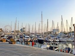 ships on the pier and yachts