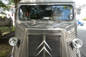 Oldtimer Citroen in the shade of trees close up