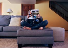 Person, reading a magazine on the grey