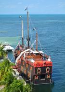 floating ship at sea red