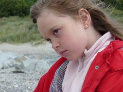 photo of a girl in a red jacket