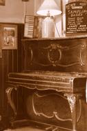 Old photo of the wooden antique piano