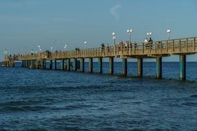 the bridge with water by the sea is big