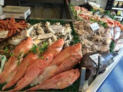 fried fish and vegetables on sale