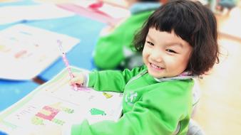 happy baby with a paintbrush