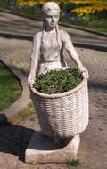 girl with a basket of grass