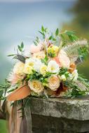 a beautiful bouquet of flowers on a rock