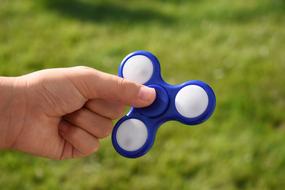 hand and spinner blue