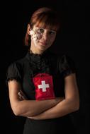 girl with a red medical cross on her clothes