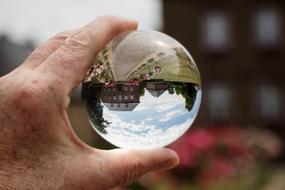inverted image of the town hall in a steal ball in Niederzier, Germany