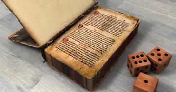 an old book with wooden cubes