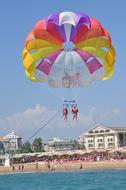 people in a parachute of color