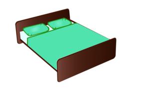 green bedding on a wooden bed