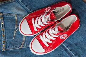 red sneakers on jeans