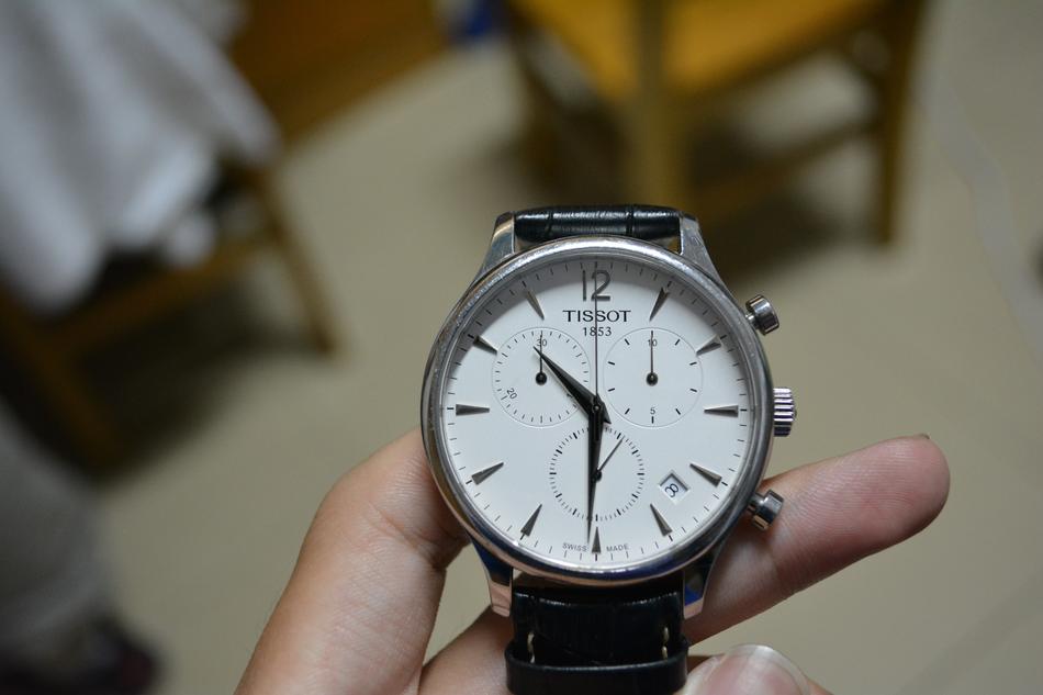 classic tissot wristwatch in male hand