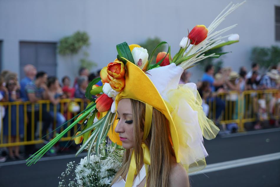 photo of a girl in a flower hat at the festival