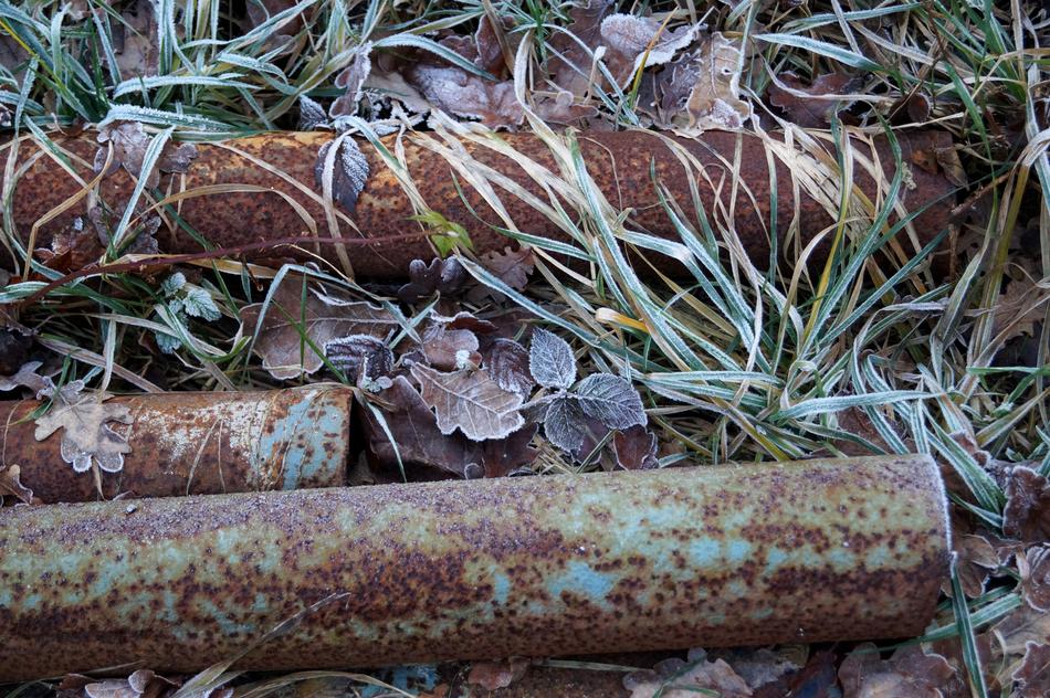 iron pipes rusty grass