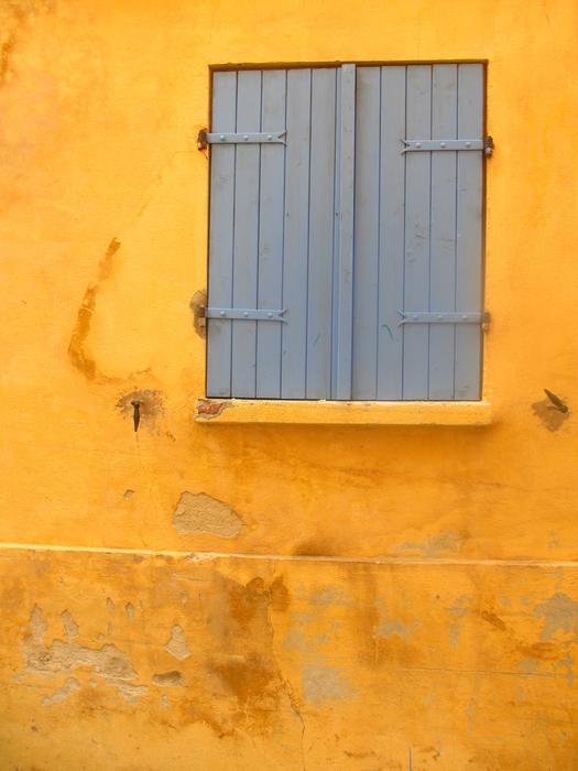 Window with Shutter on Yellow wall