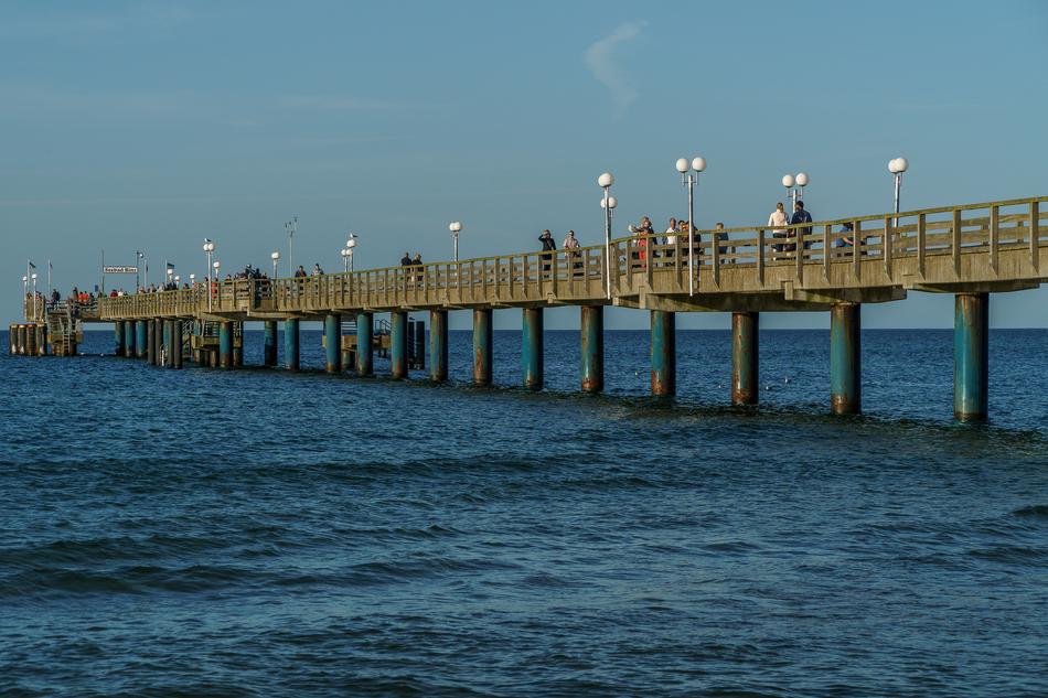 the bridge with water by the sea is big