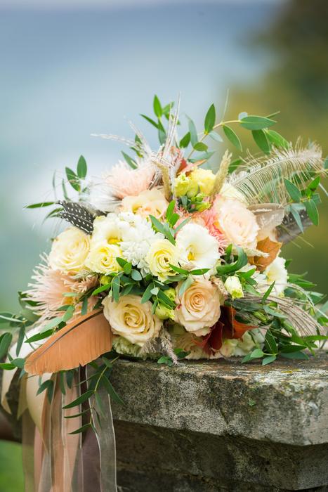 a beautiful bouquet of flowers on a rock