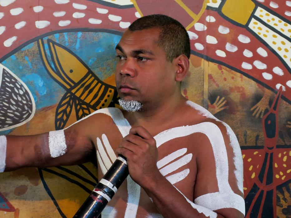 Aboriginal portrait of man with a ritual drawing