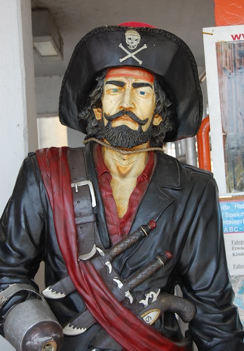 sculpture of man pirat at harbour