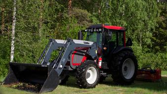 tractor on grass landscape