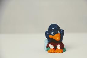 funny penguin sitting figurine