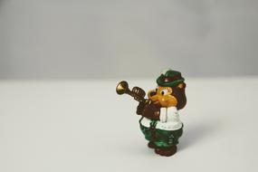 ceramic Chipmunk plays a trumpet
