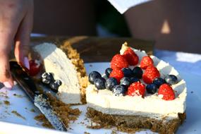 Sweet cake with berries and cream