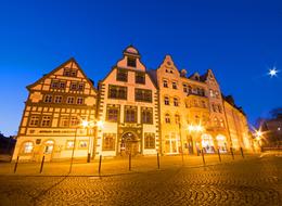 a beautiful street with streetlights