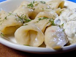 delicious dumplings with sour cream
